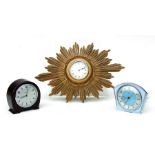 A vintage 1970's Sunburst wall clock, 44cms wide; together with a Smiths mantle clock in a