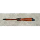 A mahogany twin-bladed propeller, approx 200cms long.