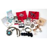 A quantity of costume jewellery to include silver rings and a pendant.