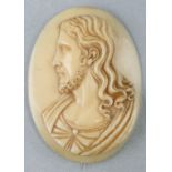 A finely carved Dieppe ivory brooch depicting the head of Christ, 5 by 6cms.Condition ReportMinor