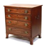 A 19th century small mahogany chest of four long graduated drawers with carrying handles to the