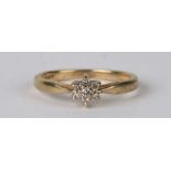 A 9ct gold diamond cluster ring, approx UK size 'M'.