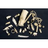 A large quantity of late 19th / early 20th century ivory items to include a vase, figures, a bead