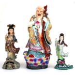 A Chinese porcelain figure depicting Shoulau, 46cms high; together with two similar figures (a/f).