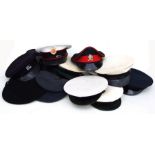 An assortment of twenty (20) Military Caps & Berets some with their cap badge attached including