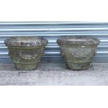 A pair of reconstituted stone garden planters with swag decoration, 48cms diameter (2).Condition