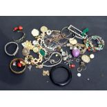 A quantity of costume jewellery to include bangles, bracelets and pendants.