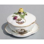 A Meissen lobed shaped bowl and cover on stand with finely painted picture panels, 12cms high.