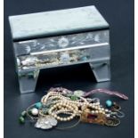 A quantity of costume jewellery to include a faux pearl necklace, bangles, earrings and other items,