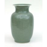 A Chinese celadon vase with incised floral decoration, 29cms high.Condition ReportDrilled for