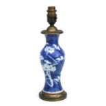 A Chinese blue & white prunus vase converted to a lamp, overall 30cms high including fittings.