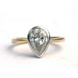 An 18ct gold diamond solitaire ring set with a large pear shaped diamond, approx UK size 'N'.