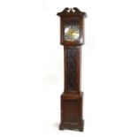 A longcase clock with 24cms square brass dial with silvered chapter ring and Roman numerals,