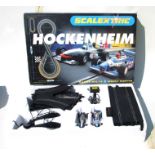 A Scalextric Hockenheim set; together with other cars, accessories and track.