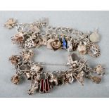 Two silver charm bracelets, both with numerous charms, total weight 103g (2).