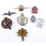 A group of military sweetheart brooches and cap badges to include The Tank Corps and a RAF Wings