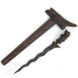An Indonesian kris dagger with wavy blade. Having a carved wood hilt and scabbard. Overall length