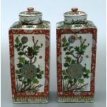 A pair of Chinese vases and covers of square tapering form, decorate with flowers and birds