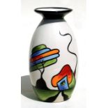 A Lorna Bailey Fantasia Cottage pattern vase, 20cms high.