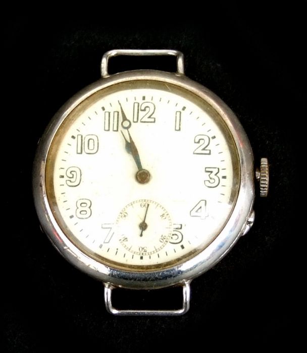 A WWI trench wrist watch, the white dial with Arabic numerals and subsidiary seconds dial, in a