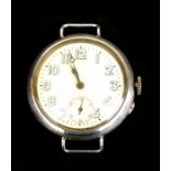A WWI trench wrist watch, the white dial with Arabic numerals and subsidiary seconds dial, in a