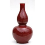 A large Chinese flambé double gourd vase, 36cms high.