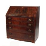 A 19th century mahogany bureau, the fall-front enclosing a fitted interior, above four graduated