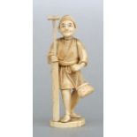 A Japanese carved ivory okimono figure depicting a peasant, two character mark to base, 16cms high.