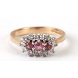 A 9ct gold zirconia and pink stone dress ring, approx UK size 'O'.