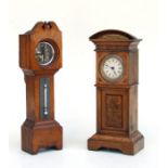 A miniature longcase clock with thermometer, in an oak case, 29cms high; together with another