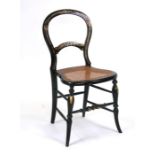 A Victorian ebonised occasional chair with mother of pearl inlay and gilt decoration, cane seat