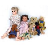 A vintage mohair teddy bear with pacifier, approx 34cms high; together with a felt doll in the