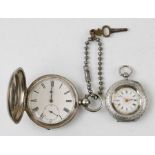 A late Victorian silver hunter pocket watch with engine turned decoration and white dial with