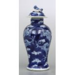 A Chinese blue & white lidded vase decorated with dragons chasing a flaming pearl amongst clouds,
