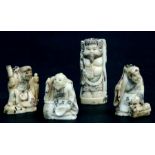 A group of bone or 'Mammoth' ivory figures in the form of robed scholars, the largest 7.5cms (4).