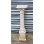 After the antique. A carved alabaster Corinthian column on a stepped square base, 88cms high.