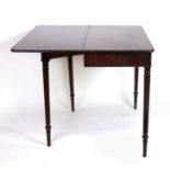 A George III mahogany tea table with a shaped rectangular fold-over top above a plain frieze, on