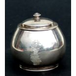 A white metal lidded sugar bowl, initialled, weight 261g, 9cms high.Condition ReportDeeply scuffed