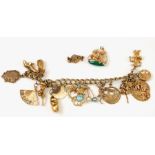 A 10ct gold charm bracelet with various 9ct, 10ct, 14ct, 18ct and yellow metal charms, total