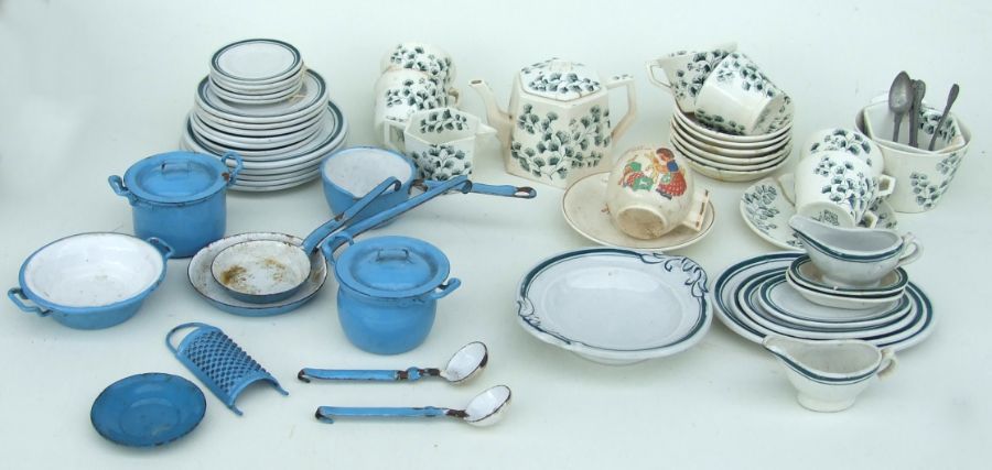 A bedtime nursery cup & saucer; together with other doll's tea services including a 1950's blue