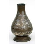 An Islamic Damascus copper footed vase with overlaid silver decoration, 23cms high (a/f).