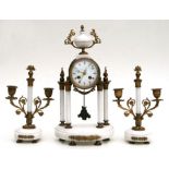 A 19th century French gilt metal and white marble clock garniture, the white enamel dial with
