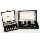 A boxed silver three-piece cruet set, Birmingham 1937; together with a boxed set of silver spoons,