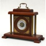 A mahogany and Brass West German mantle clock, the dial signed 'Mercedes', 25cms high.