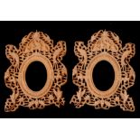 A pair of Chinese pierced wooden photo frames, overall 17 by 22cms (2).