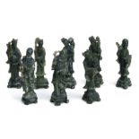 A set of eight carved soapstone figures depicting wise men and sages, each approx 24cms high (8).