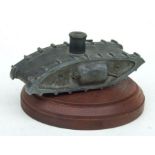A WW1 trench art Tank with side machine guns and moving gun on the central turret. Made from tin,