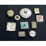 A group of vintage compacts and vesta cases.