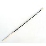 An Asian backscratcher with ivory handle and figured hardwood shaft, possibly Zebra wood, with eagle