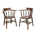 A pair of beech & elm smoker's bow armchairs (2).Condition ReportThere is a split to the join of